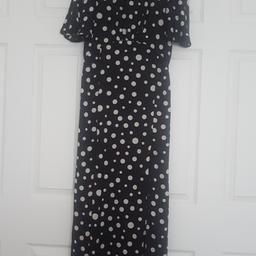 polka dot maxi dress with 2 splits at the front and an open back. 
excellent condition