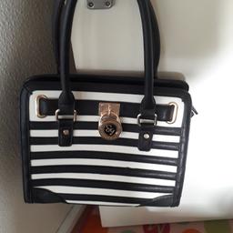 black and white stripped handbag excellent
condition collection only