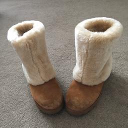 These boots were purchased directly from Ugg & have been worn once around the house so are in impeccable as new condition.

The colour is Chestnut With Rolled Down Faux Fur.

I am a UK Size 8 & have to buy a UK Size 8.5 which these are.So if you are a UK Size 8 normally then this is the size for you.

PLEASE NO PAYPAL DUE TO FRAUDSTERS

CASH ON COLLECTION OR BANK TRANSFERS ONLY PLEASE.

Comes from a clean & smoke free hom
