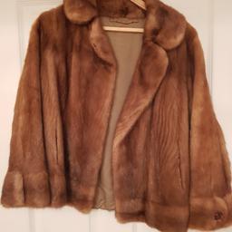 This is a vintage style 1970's real fur jacket. It needs a small stitching repair to the inner lining at the armit which can't be seen when worn... otherwise in good condition, hence the price. Size 10