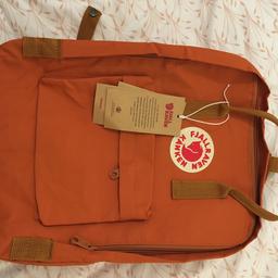 Original backpack, completely new without any uses. Medium size (16L), dark orange and waterproof.