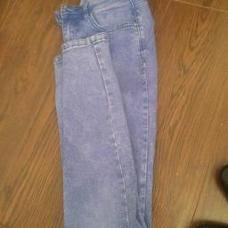Really bright blue denim fabric is soft and stretchy (not like hard denim) jeans are size 10 and have rips in knees,acid wash effect through fabric.