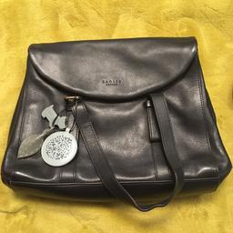 Black radley handbag. Lovely condition used only a handful of times. Inside is immaculate condition with 2 compartments. One has an internal zipped pocket embossed with radley dog. The other has 2 pouch pockets. Comes with adjustable shoulder strap and dust bag