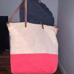 Nice creamy and pink bag 
Very light 
Has a lots of space