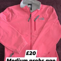 North face jacked pink probs fit age 10 says M on the tag