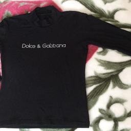 Dolce & Gabbana Ladies Black top, stretch, size 8-10, sleeves are 3/4, the writing is in tiny ‘diamanté’s ‘, few stones are missing but not that noticeable, there was a label at the side inside but was cut off, I’m in Deal but can post for £4 recorded. No Time Wasters please! Take a look at my other items