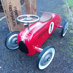 kids metal ride on racing car never been used just assembled it , bought 20 years ago ,never opened