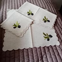 Set of 4 beige linen napkins scallop edge with olive motif on one corner. 15x15 "