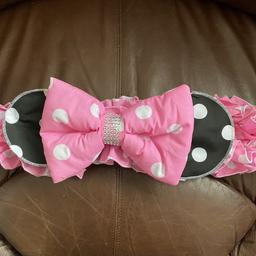 Minnie Mouse bow for pushchair/pram, hooks on by elastic. Looks beautiful and easy to take on and off. £10 collection Shoeburyness, on other sites