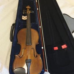 used violin in case just needs the two strings put back on hence bargin price otherwise perfect.