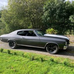 1971 355 V8 Chevy Chevelle just finished in a custom grey metallic pearl with white racing stripes. Paint is high quality and the sides and hood and trunk have been cut to make glass, the roof is near enough glass out the gun.

Cash sale / finance available not looking to swap / PX and if you want to know the reserve bid your highest bid make an offer.

Has had new heads and head gaskets and has had a new holley carb and fuel pump fitted  so goes as well as it looks.

Mods wise she has a bored over to 355 V8, rhino long tubes, custom twin exit 3" exhaust. Turbo 400 autobox with floor mounted shifter all rebuilt stateside and working properly, Weiand intake, new performance ht leads, autolite platinum plugs and oil and filter change completed today. She is solid as anything all metal car, Power steering, AC, Disc brakes new bushes and other bits and bobs done over the past week,

No rust at all see pictures of underneath.

Interior is spot on, black vinyl bench, deep pile carpet is epic. All gauges work, perfect underneath.

Blacked out grille and tail lights with LED Halo headlights lift the car.

To sum up if you’re looking for a muscle car with super shiny paint to potter about with/ make your own this is well worth a look.

Delivery to Ireland, Belgium, Malta, Spain, France, Cyprus, Italy, Germany etc is no problem.

UK delivery via our lovely professional transporter roughly £1 a mile