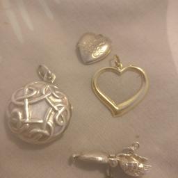 small bundle of gold and silver gold heart and silver lockets and a silver swan