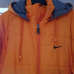 Lovely bright orange Nike hooded jacket. Size medium but is generous. Only worn once so like new.