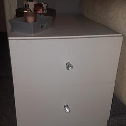 I have x2 white high gloss 2 draw set of draws with Crystal knobs.
these are about 2 years old & apart from a water mark in one of the top draws ( don't affect use ) they are in really good condition

£20 each