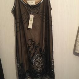 Size 12, never worn, new with tags, rrp £60, beautifully beaded.
