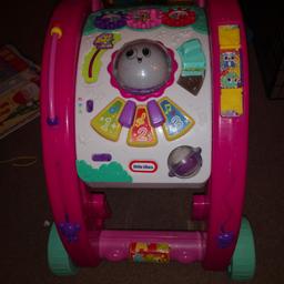 Pink 3 in 1 walker. Brilliant for little ones learning to walk. Has lots of little bits for play with. When used as walker it lights up a disco project in the floor. Can be used folded up for storage or floor play.