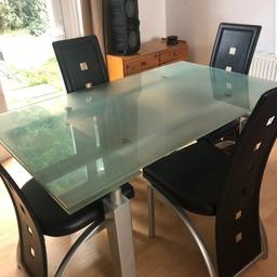 translucent ( light aqua marine)extendable ( can seat 8 ) dining table excellent condition speckled silver legs and base no scratches as always had a table cloth cover matching chairs no marks or scuffs ...90