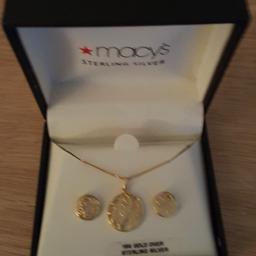 18k gold over sterling silver very pretty set, I have never worn it,