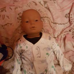 real care baby he's been tested and it's working fine but needs new batterys he comes with two sets of clothes nappys bottle id tags program dvds charger only been used to test him so he's new does come with box pick up only