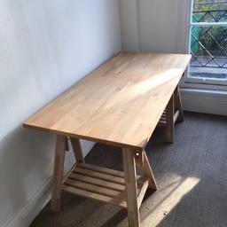 Wooden desk composed of two trestles and one top.