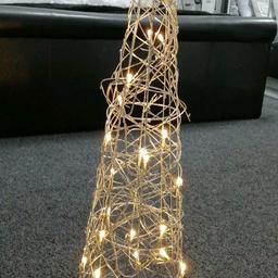 Light Up silver Christmas cone
Electeic
Has warm white lights
Height 31"
Indoor use only