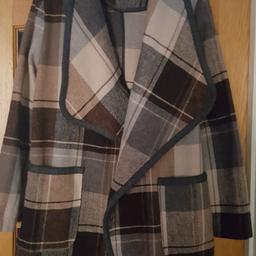 A gorgeous brown and beige check coat is a size 12 from George asda. Bought for my daughter only wore a couple of times! still has plenty wear in it...grab yourself a winter warmer and neutral colours match any of your outfits.