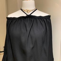 Ladies off shoulder top. Black. Size L (14). 

Great with jeans, trousers or leggings.