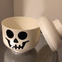This is a Lego head jar in the skull Halloween design.  

It is in excellent condition as shown in the photographs. I’m happy to post - I’m also selling a large Lego head too!
