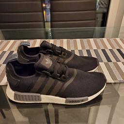 An original pair of men's Adidas NMD in black/white.

Condition Brand New - UNWORN - Unboxed.

Available in UK Size 11.