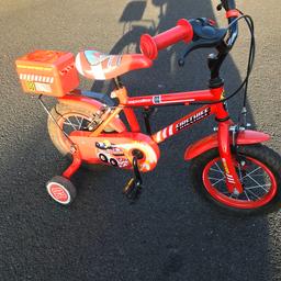Apollo fire chief bike with stabilisers, in excellent condition.

Features:
- Front and rear calliper brakes
- Full chainguard to protect little fingers and clothing
- Mudguards to protect clothing from spray and mud
- Stabilisers can be removed as confidence grows
- Comes with a handlebar plaque, bell and rear tool box
