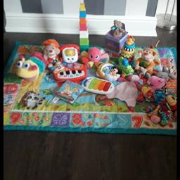 bundle of baby toys ex condition comes with play matt.