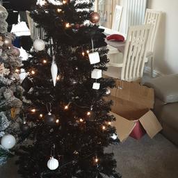 Black 6ft xmas tree complete set up .Boxed,stand,lights,baubles.All included lovely slimline tree if space limited.
Also Christmas wreath with battery and  lights 2ft tall. brand new batteries included.Will also include 3ft white slim tree in box.not in picture.
3 items for 25 !!!! be quick.
might be able to drop off locally within 3 miles of bl98jw.
priced to sell ..lower offers ignored ..