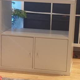 White IKEA unit with two cupboard doors. 
weve taken the middle insert out as we wanted it as a shelf.
Collection only