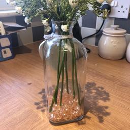 I have 9 glass bottles we used as centre pieces for our wedding. Comes with fake gypsophila and orange/clear beads