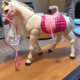 Barbie interactive walking horse. It walks makes horse sounds lifts its head and moves its tail. Can be seen working.