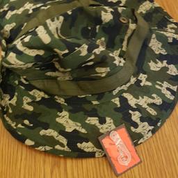Vrand New Camo hat ideal for fishing walking camping etc... The hat features press poppets studs around hat to take the brim up when the sun goes down.. This hat also has a neck drawstring ti hold the hat in place when the wind is gusty. Sold from a smoke and oet free home.