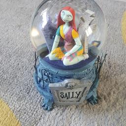 disney rare sally nightmare before Christmas snowglobe in great condtion collection or can post see all pic s any questions just ask x