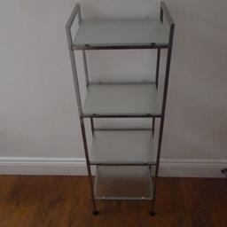 This is a four tier chrome and glass bathroom shelf rack.
It is 33cm wide x 25cm deep x 115 cm high overall.
Used,but still good condition.