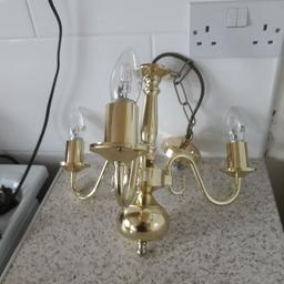 two light fittings  ones a five arms and the other is three arms,  both in good condition