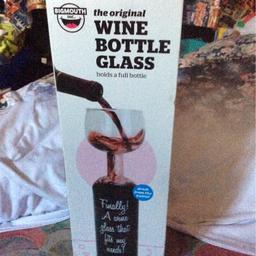 Wine bottle glass holds a full bottle