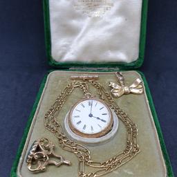 14k Gold Pocket watch in working condition, dust cover not gold comes with a 9ct gold Figaro Style Chain separately a 9ct Gold Fob and a 9ct Bold brooch where you can clip the watch if you like. All marked for gold please have look at the photos the watch has fabulous engravings and is in original box. The watch approx 4.4 cm with the loop, Chain approx 20 inches. Any questions feel free to ask.