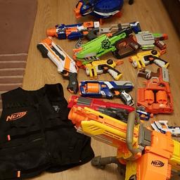 selection of nerf guns with vest and small selection of bullets