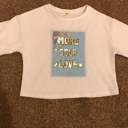 Brand new never worn girls river island short T-shirt with details on the front sequins inside that move around