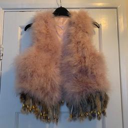Brand new real fur gilet , looks gorgeous on but sadly I have too many , would be best suited to sizes 6-10 
Bought from a fur boutique and cost £120 
Would make a fabulous Christmas gift.
Sadly the pictures do it no justice 

I’m happy to post my items however postage will be £4.80 signed delivery to ensure you receive it safely