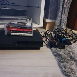 ps3 excellent condition 1 controller 6 games and singstar mics hardly been used
