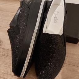 Black glittery slip on shoes. 

Brand New!! Never been worn. 

They are a size 8 but are a small 8 so I'd say more like a 7.