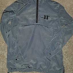 11° over the head jacket medium man 
silver pocket across chest and hood