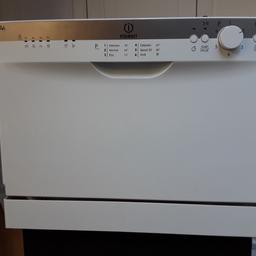 Compact tabletop white Dishwasher.Indesit ICD 661uk. Width 550 mm ( 213/4"). Height 435 mm (17 1/4"). Depth 545 mm ( 21 1/2").(possibly fit inside 600 mm cupboard).Fair,clean working order. area code WV4 6PQ.