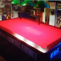 Move forces sale of my Pool table and accessories. This is a 7x4 slate Pool Table,recently recovered in Red cloth as seen in the image.
Sale includes 4 cues,1 rest ,set of almost new Blue & Yellow Pool balls and triangle and the overhead lights as seen in the image. Buyer collection only from London Borough of Havering. Will help to dismantle. Thanks for looking.
More pictures may follow once I've finished packing for the move.