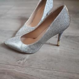 brand new, never worn size 5. glittery shoes which are unusual as they shimmer both gold or silver depending how the light catches them. lovely detail on heel. still got price tag on.